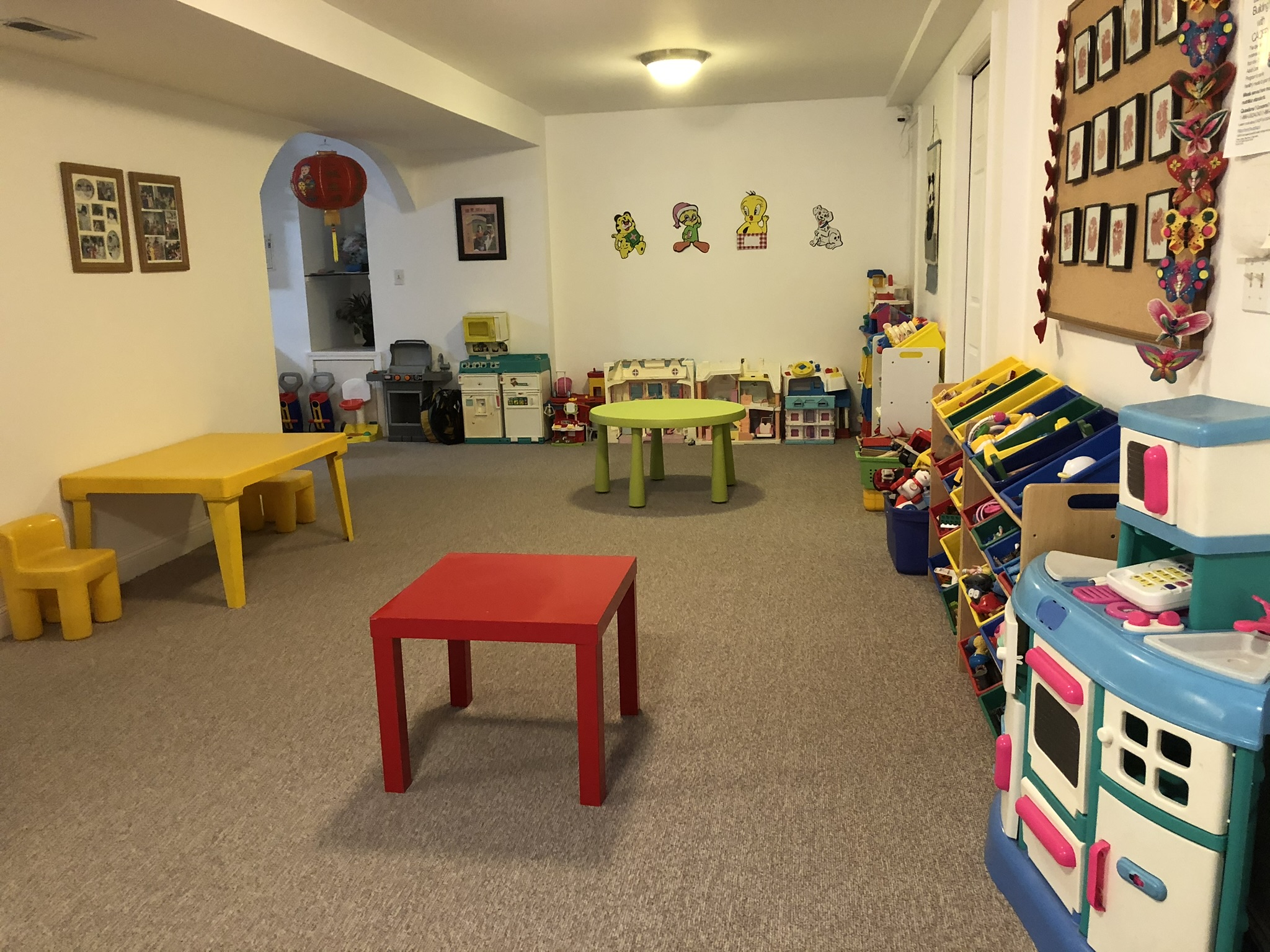 Little Pandas playroom with toys and child-sized tables